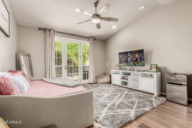 a view of a swimming pool with a patio and a garden