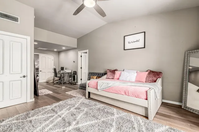 a living room with furniture a rug and a chandelier