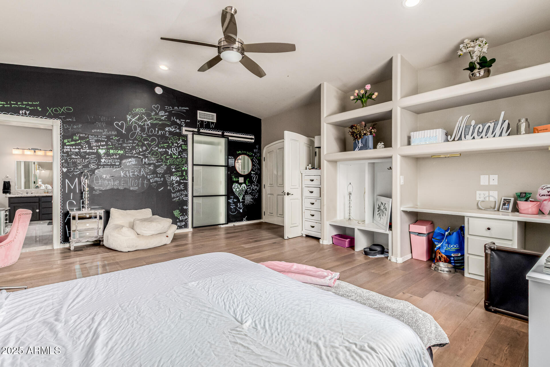 6050 North Paradise View Drive Paradise Valley, AZ 85253 - Photo 49 of 79 a bedroom with a large bed and a chandelier