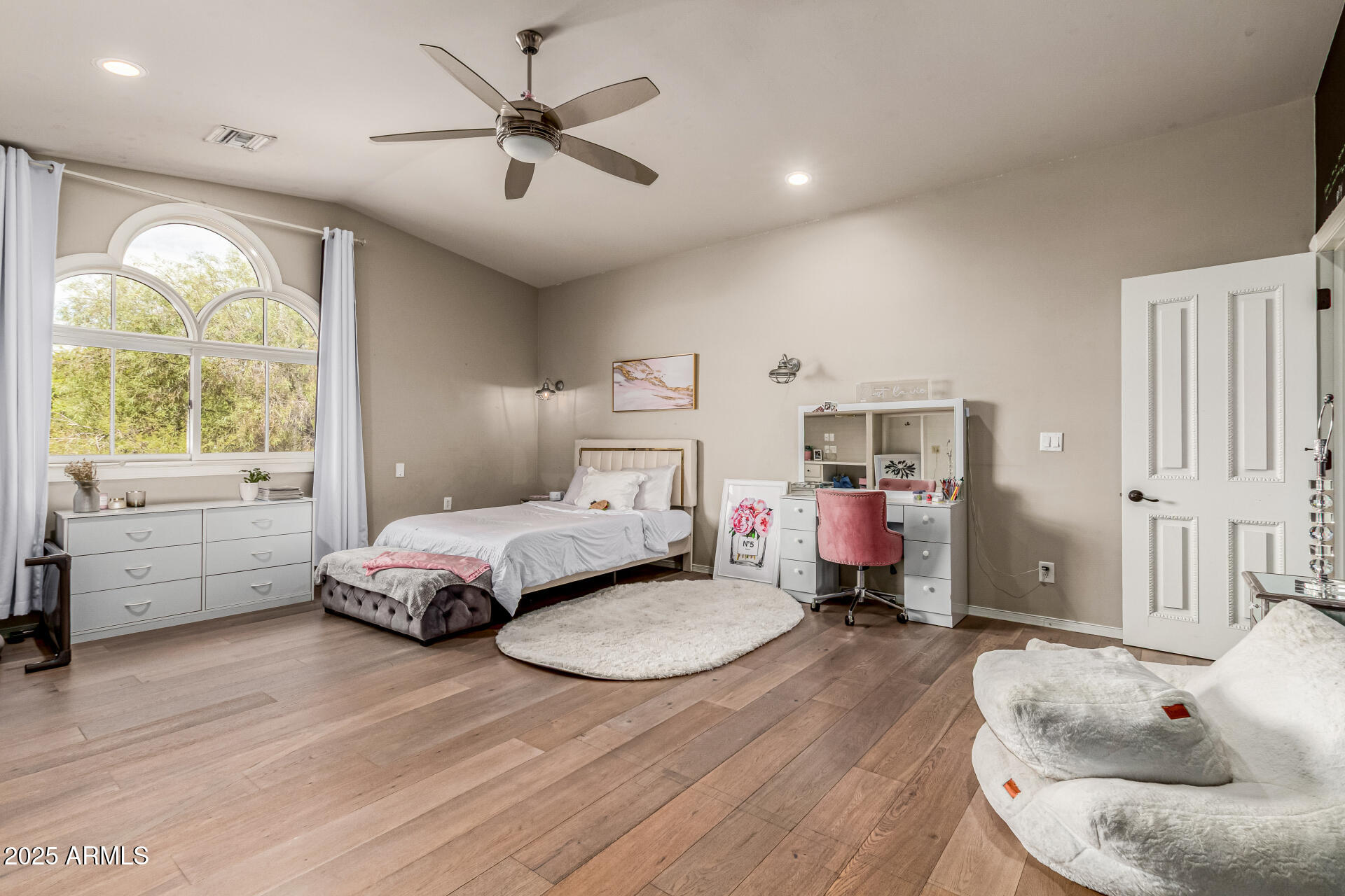 6050 North Paradise View Drive Paradise Valley, AZ 85253 - Photo 50 of 79 a bedroom with furniture and a wooden floor