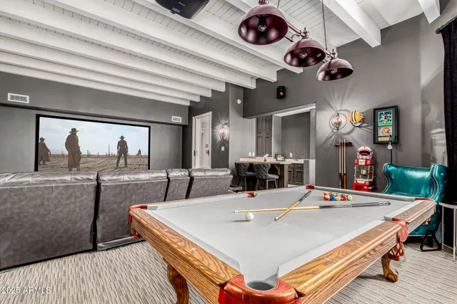 a living room with furniture fireplace and a fireplace