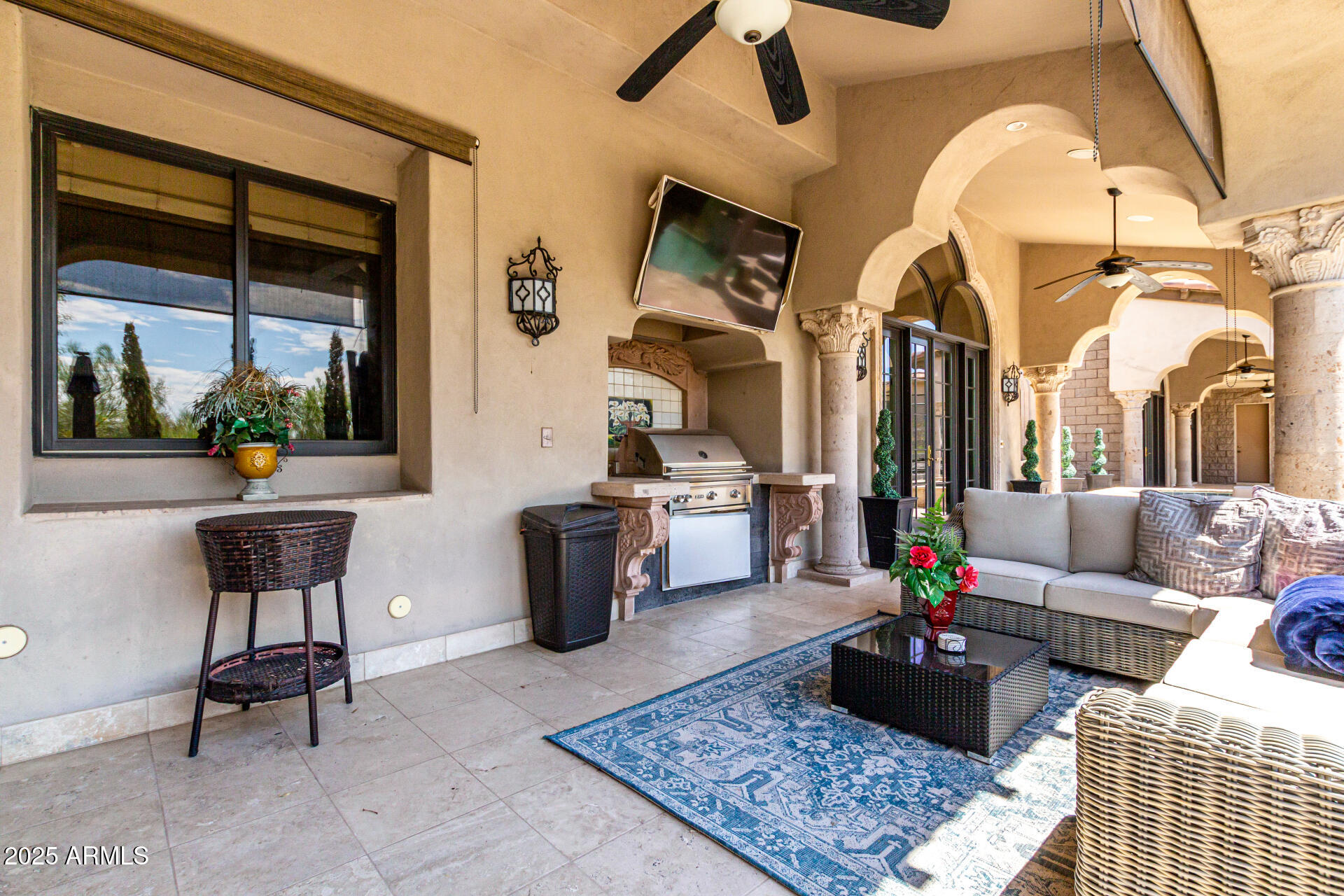 6050 North Paradise View Drive Paradise Valley, AZ 85253 - Photo 67 of 79 a living room with furniture a rug and a chandelier
