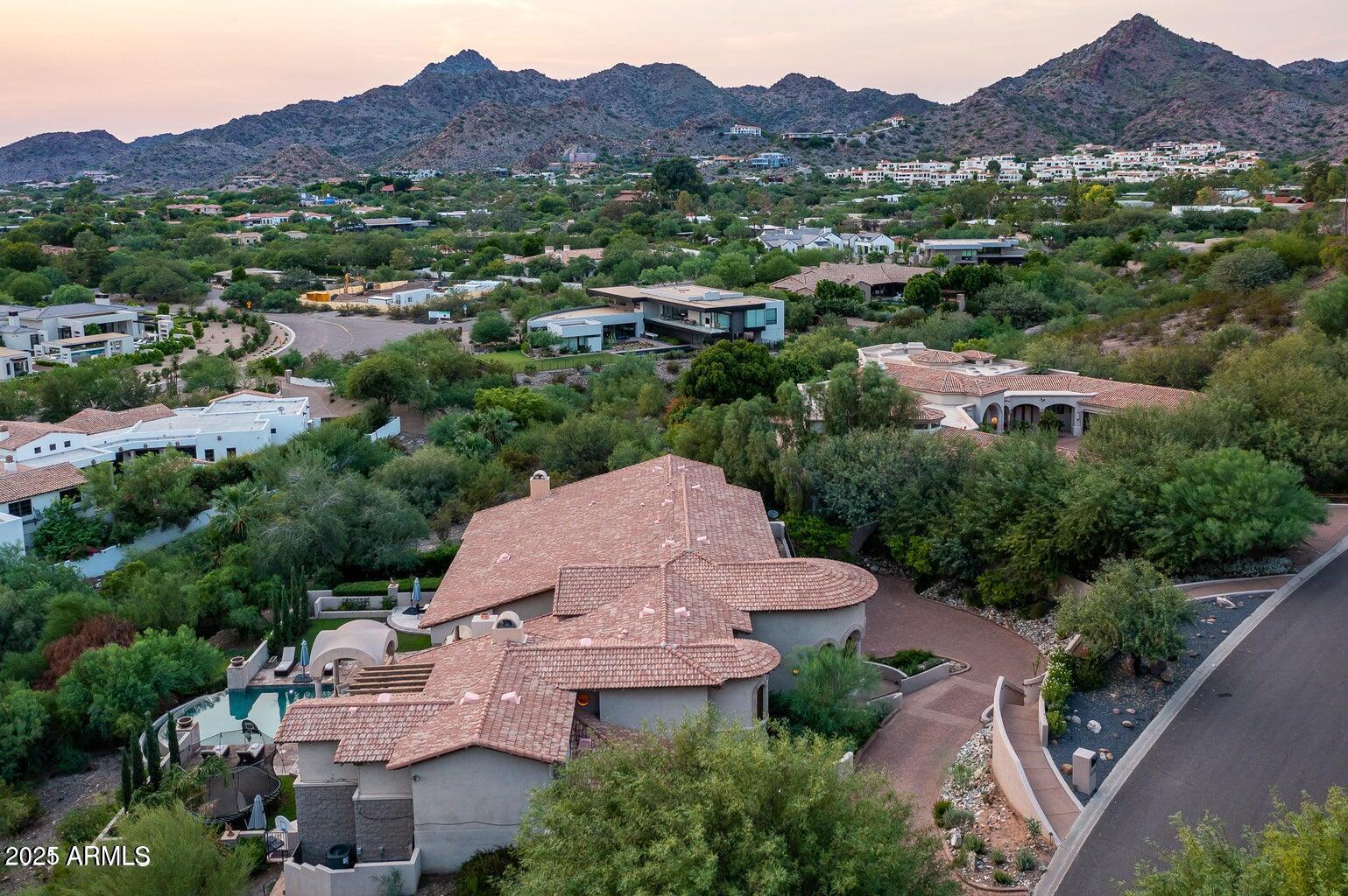 6050 North Paradise View Drive Paradise Valley, AZ 85253 - Photo 75 of 79 an aerial view of a city with lots of residential buildings and mountain view in back