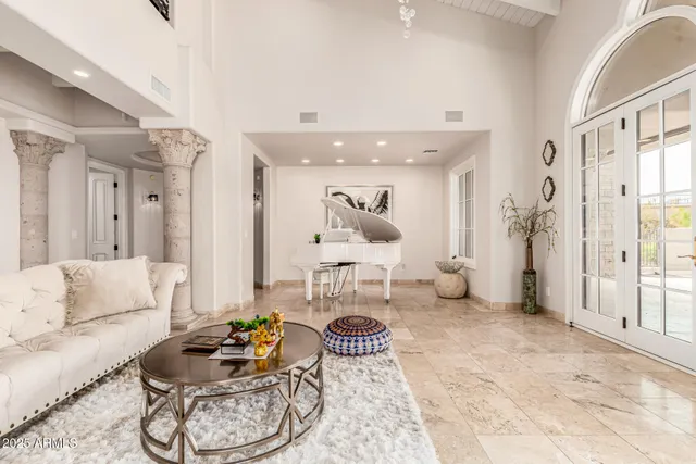 a workspace with furniture and a large window