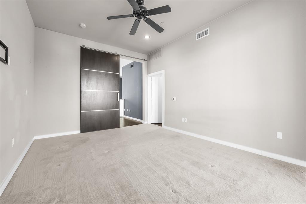 6927 Sumner Street, Unit 6927 The Colony, TX 75056 - Photo 11 of 22 a view of an empty room with a ceiling fan