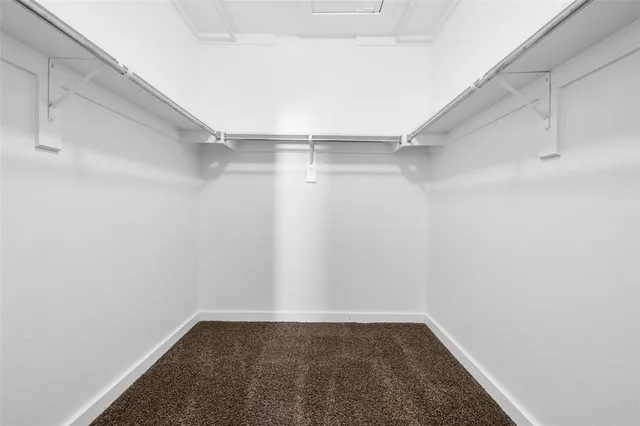 a view of a room with shelf on the wall