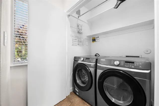 a utility room with dryer and washer