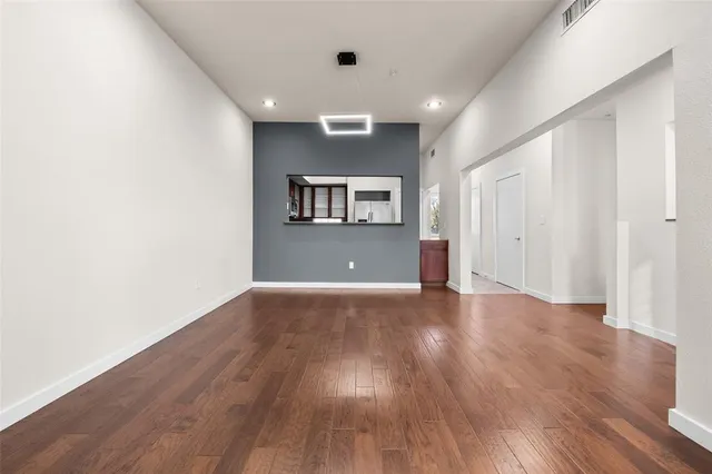 a view of livingroom with hardwood and hallway