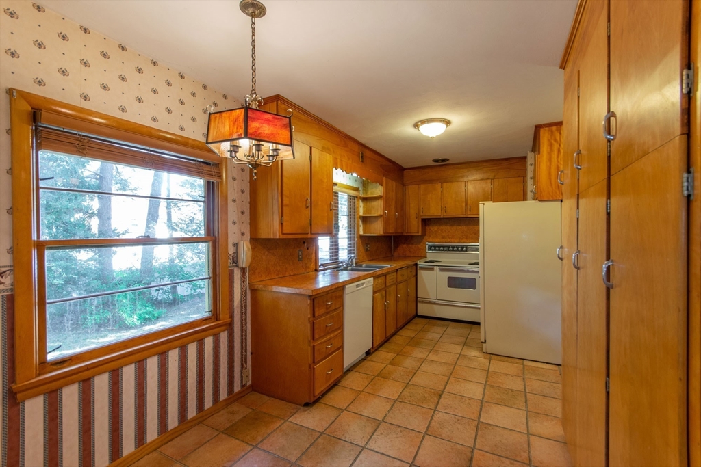 182 Dayton Street Springfield, MA 01118 - Photo 16 of 30 a kitchen with refrigerator and cabinets