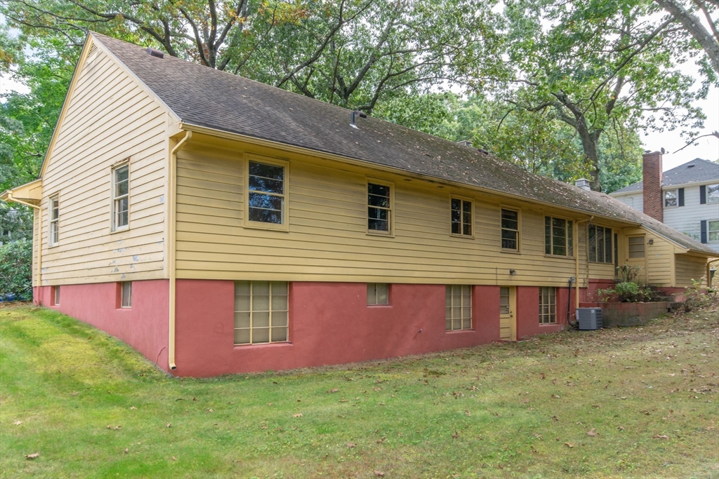 182 Dayton Street Springfield, MA 01118 - Photo 5 of 30 a view of a house with a yard