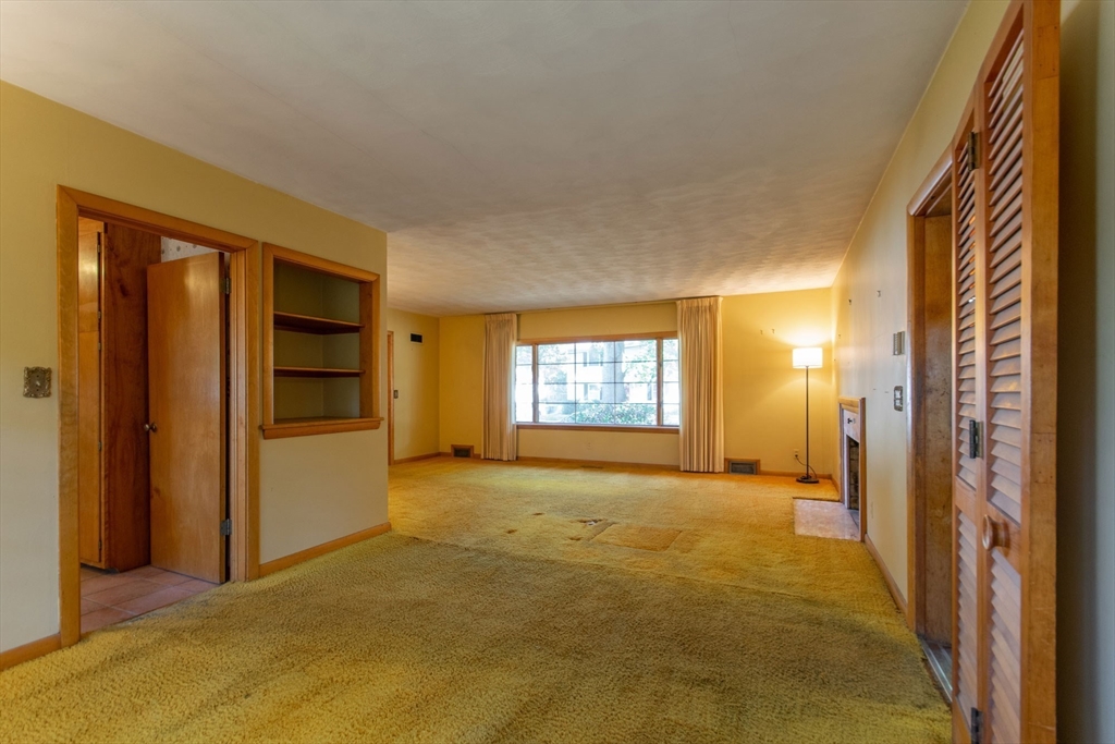 182 Dayton Street Springfield, MA 01118 - Photo 10 of 30 a view of empty room with a fireplace