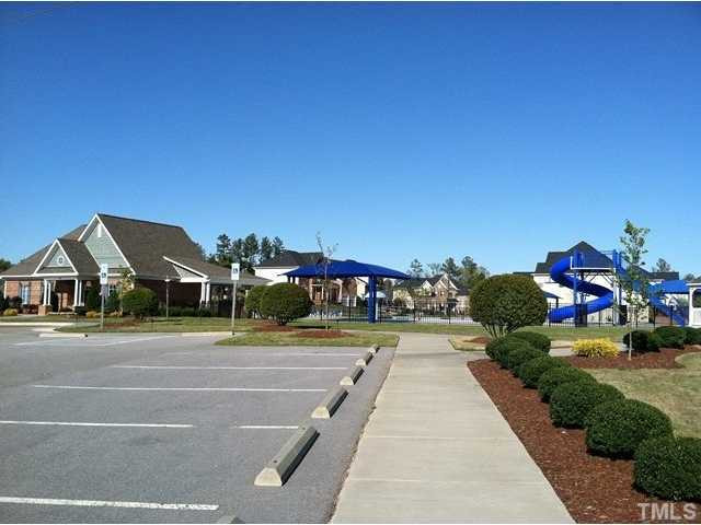 1124 Falcon Ridge Lane Morrisville, NC 27560 - Photo 2 of 3 a view of a house with a yard and potted plants