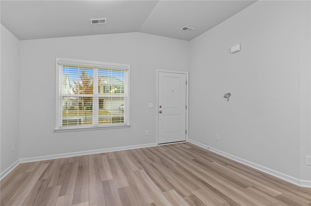 24 Chalet Court Anderson, SC 29621 - Photo 7 of 39 This bright and airy room offers an inviting atmosphere with its soaring ceilings and ample natural light.