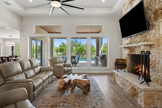 a living room with furniture fireplace and flat screen tv