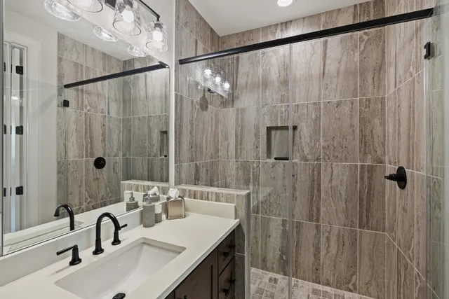 a bathroom with a sink and mirror