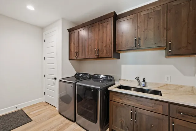 a kitchen with stainless steel appliances granite countertop a sink stove and cabinets