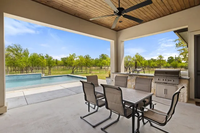 a view of an outdoor dining space with furniture