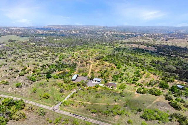 an aerial view of house with yard