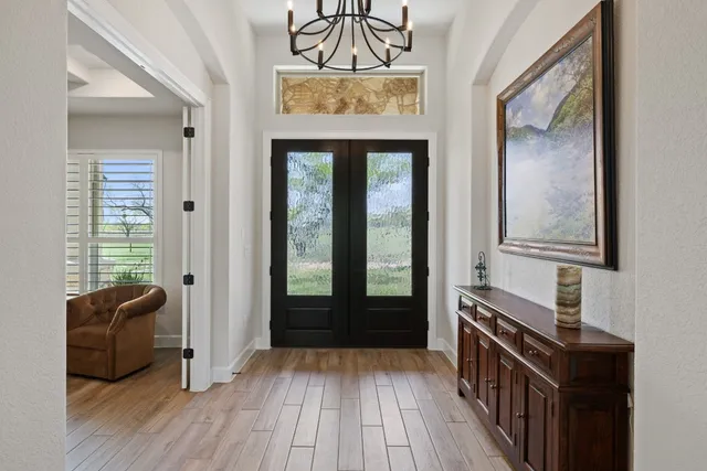 a view of front door with wooden floor