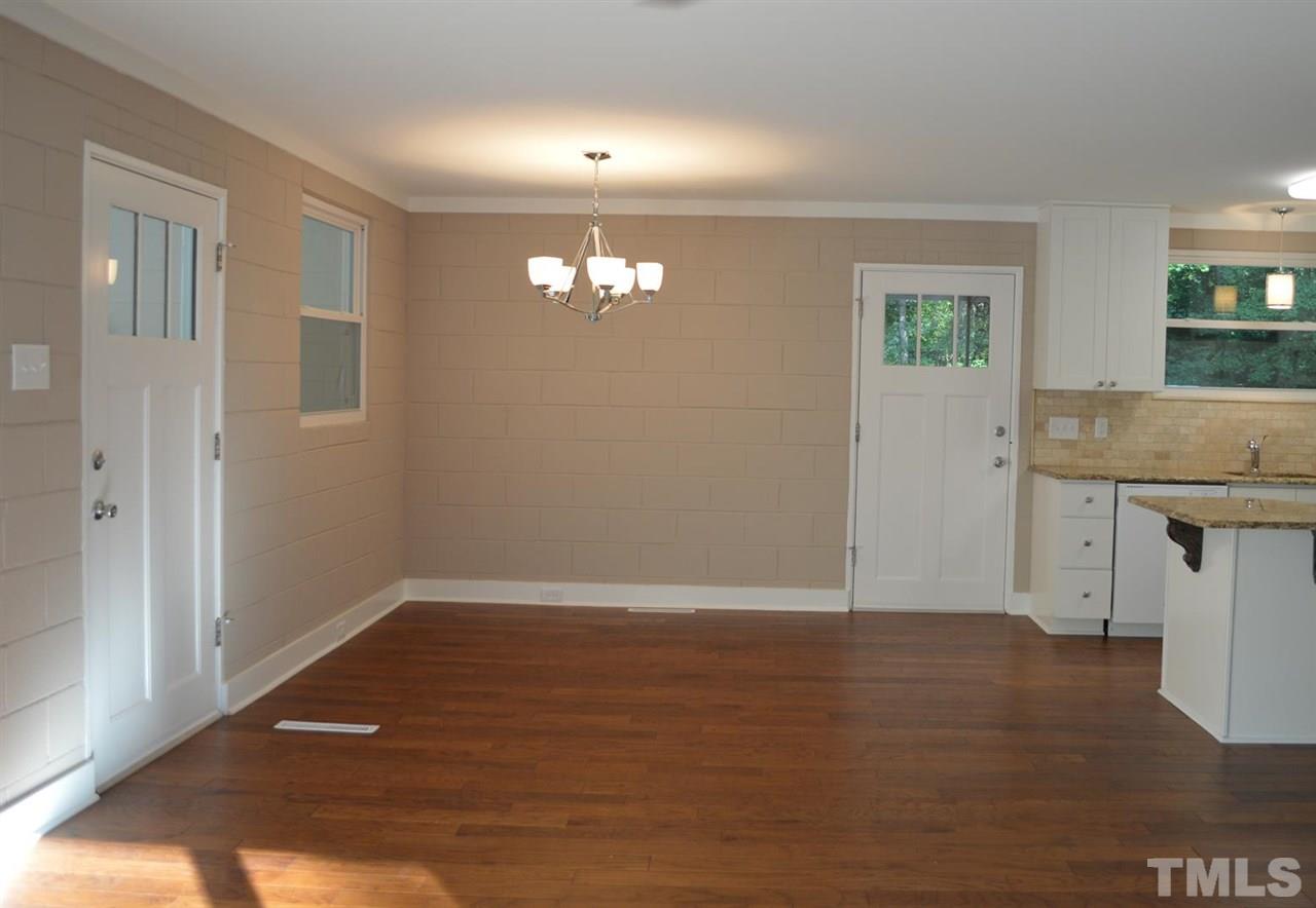 110 Nancy Rhodes Drive Durham, NC 27712 - Photo 13 of 24 wooden floor in an empty room with a window