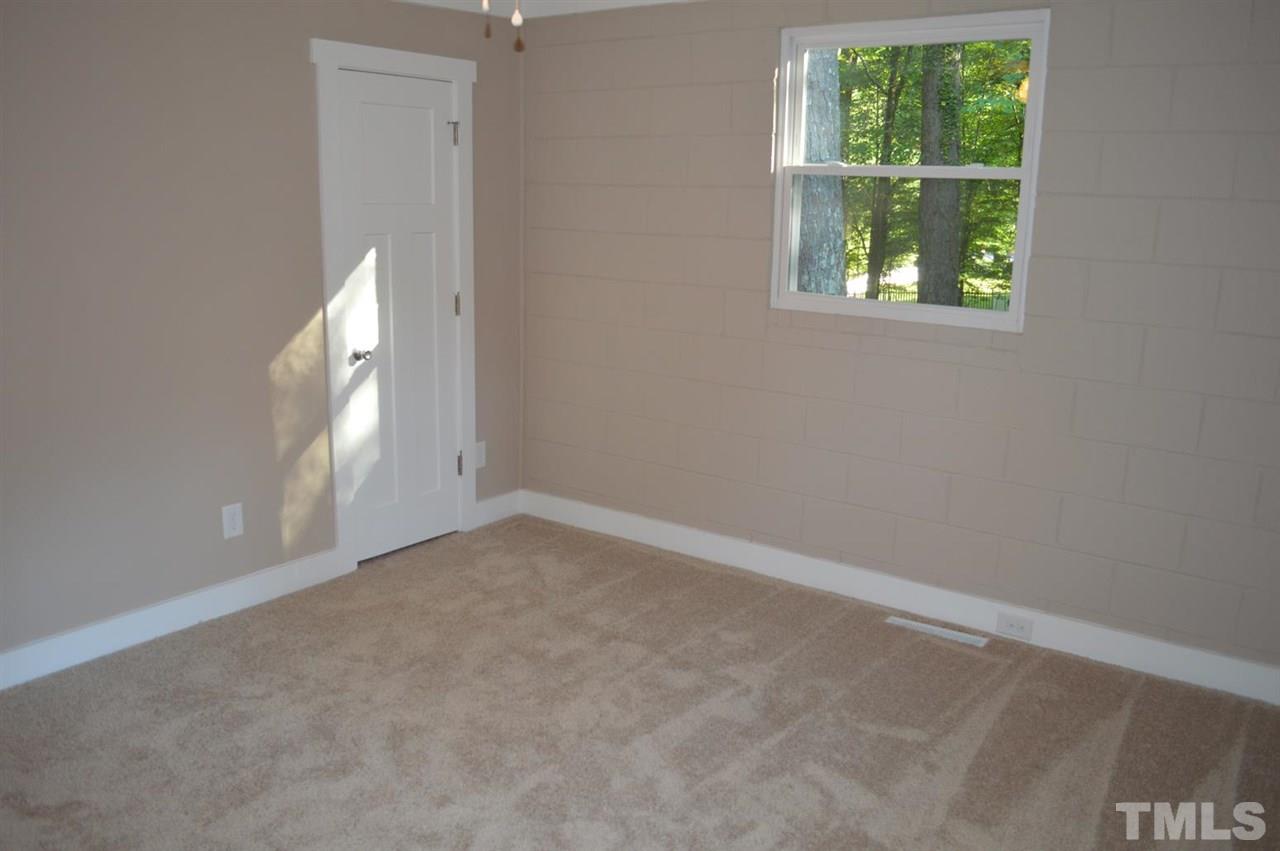 110 Nancy Rhodes Drive Durham, NC 27712 - Photo 14 of 24 an empty room with windows and entrance