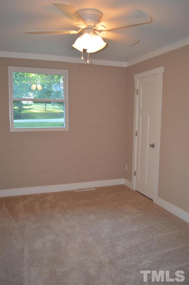 110 Nancy Rhodes Drive Durham, NC 27712 - Photo 16 of 24 a view of an empty room with a window