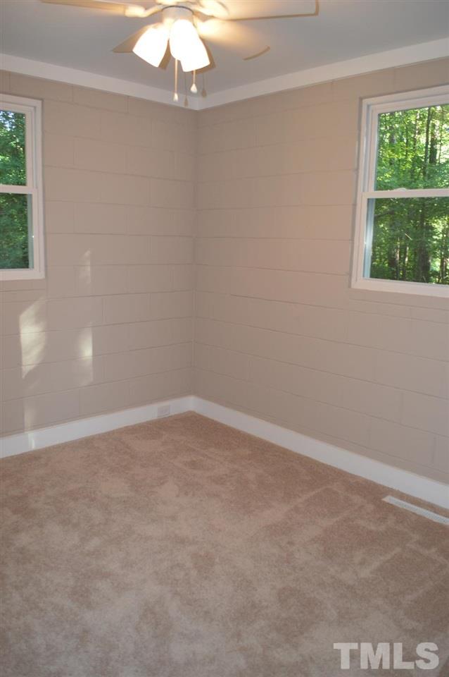 110 Nancy Rhodes Drive Durham, NC 27712 - Photo 17 of 24 en empty room with a window