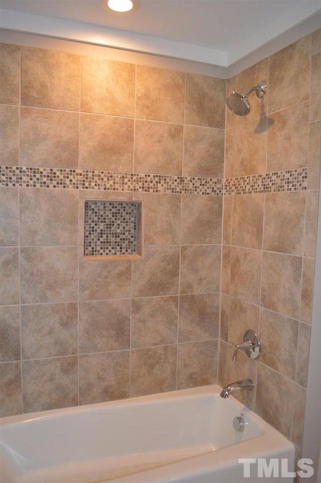 110 Nancy Rhodes Drive Durham, NC 27712 - Photo 22 of 24 a bathroom with a shower and a bathtub