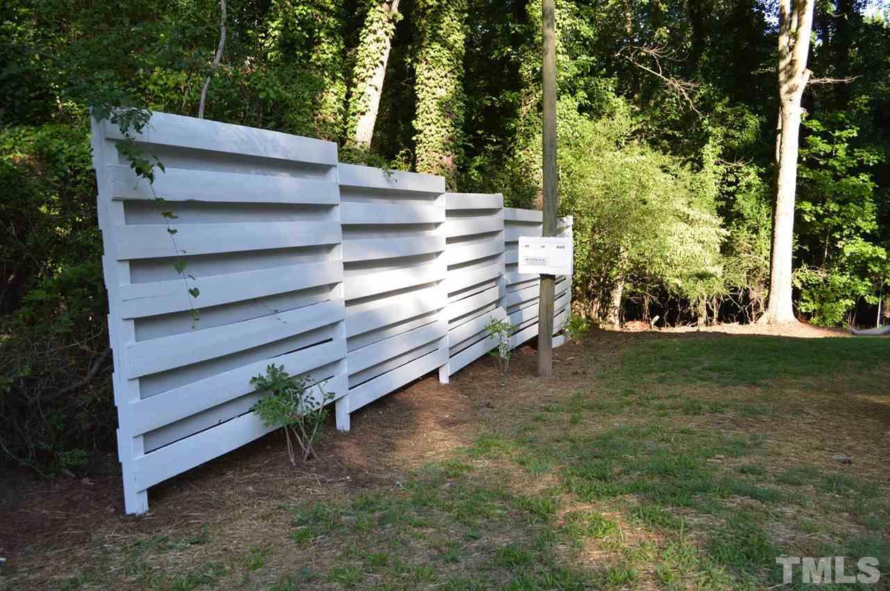 110 Nancy Rhodes Drive Durham, NC 27712 - Photo 5 of 24 a view of a wooden bench in a yard