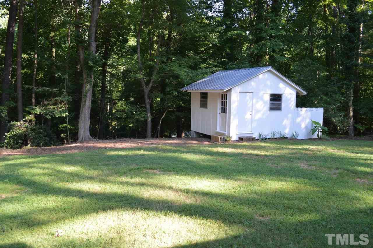 110 Nancy Rhodes Drive Durham, NC 27712 - Photo 8 of 24 a front view of a house with a yard