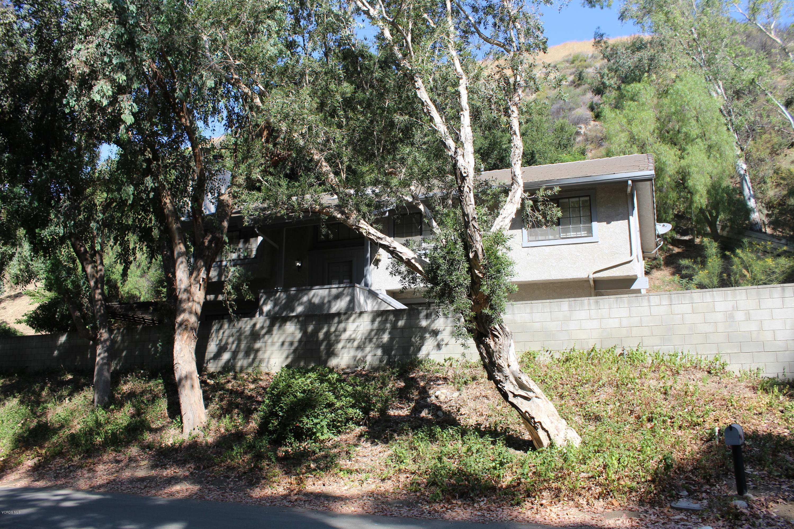 5101 Tapo Canyon Road Simi Valley, CA 93063 - Photo 1 of 6 a view of a house with a yard