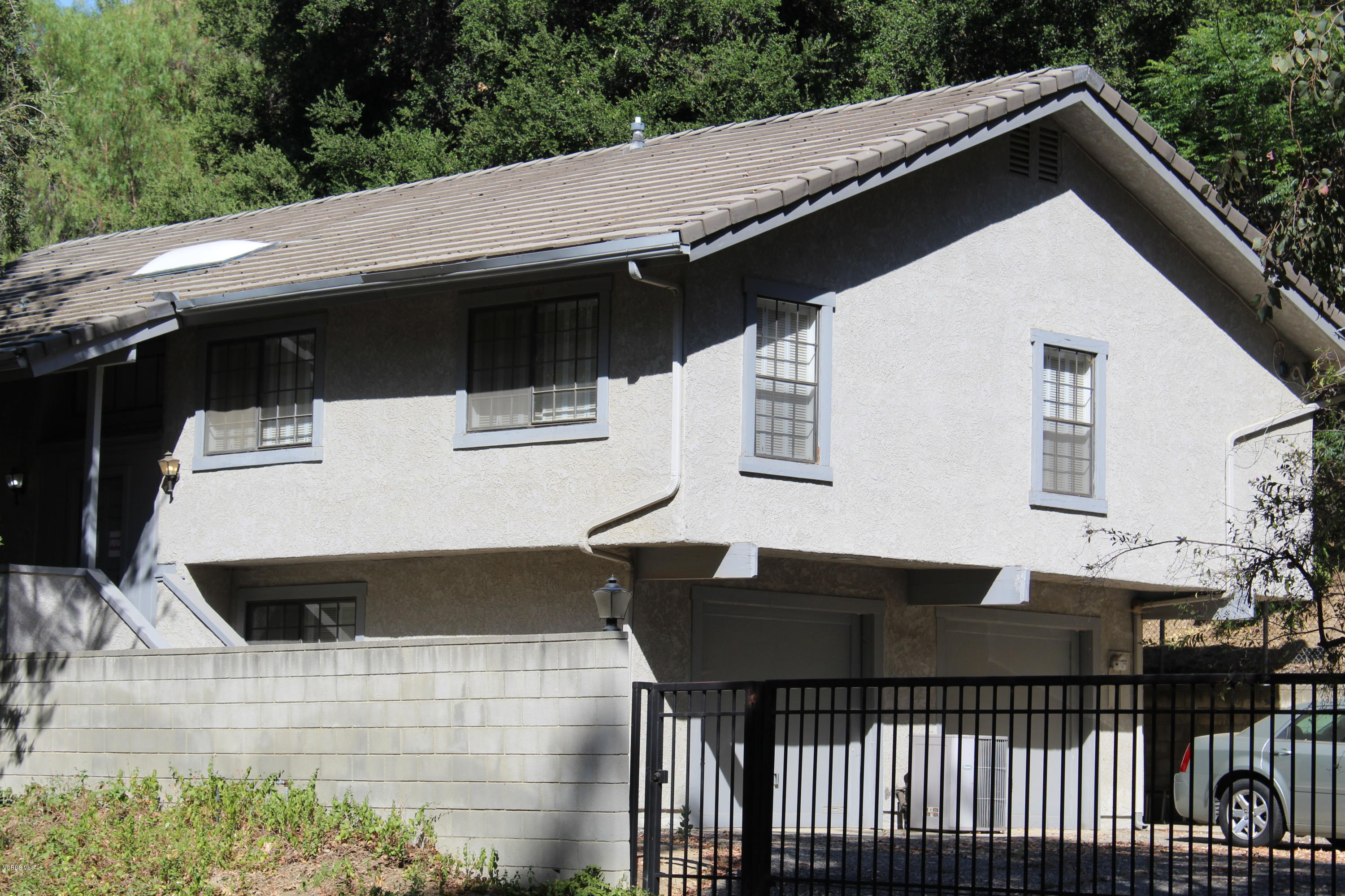 5101 Tapo Canyon Road Simi Valley, CA 93063 - Photo 3 of 6 a terrace of a house with wooden floor and outdoor seating