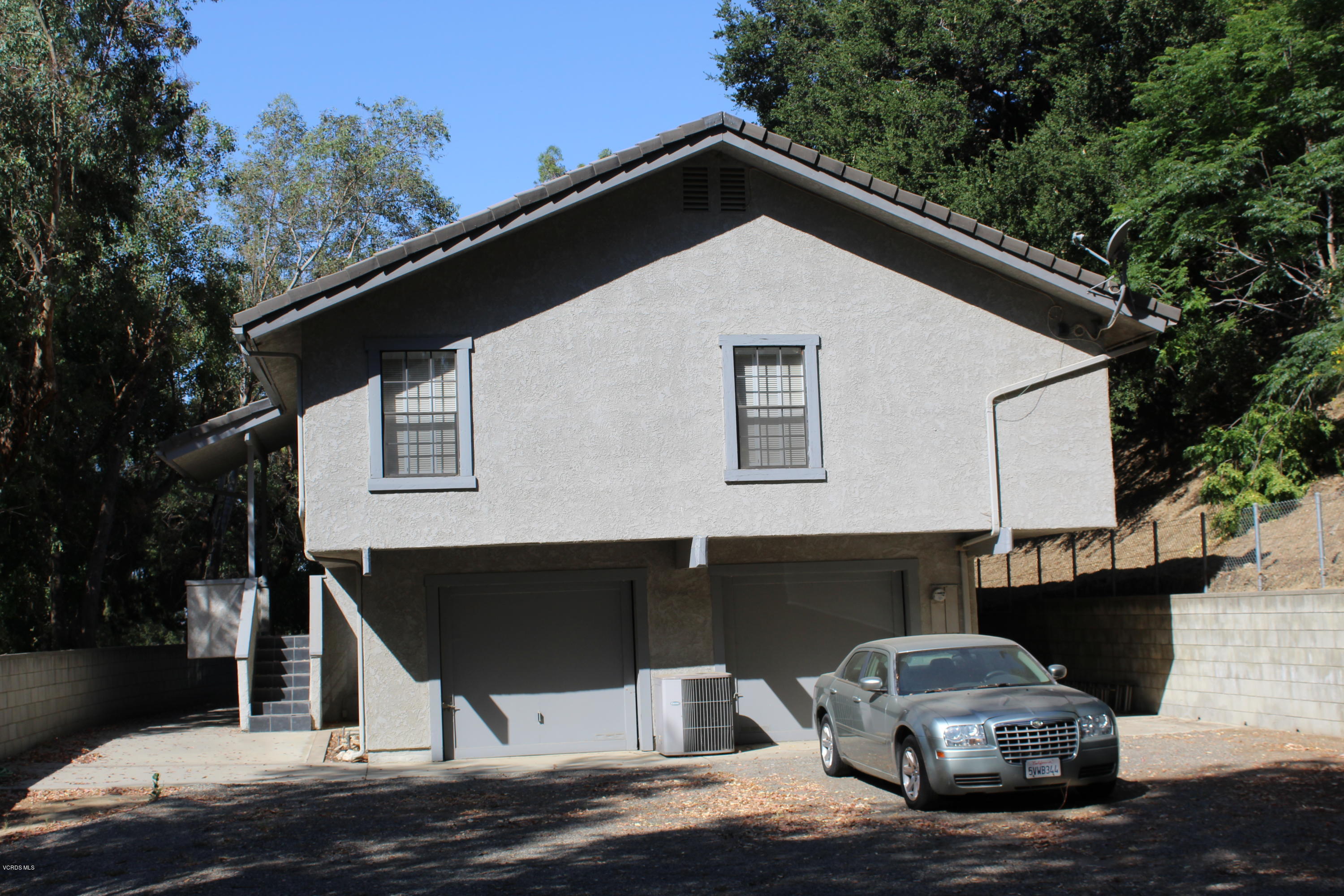 5101 Tapo Canyon Road Simi Valley, CA 93063 - Photo 4 of 6 a front view of a house with parking