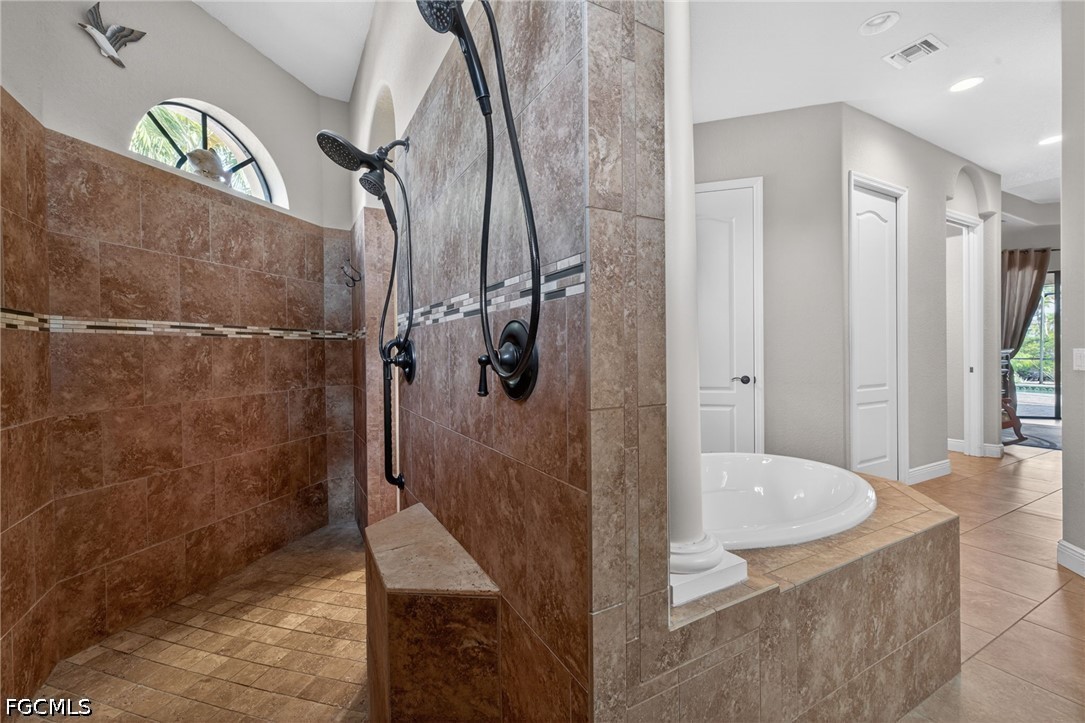 6109 Calusa Rdg Trail Bokeelia, FL 33922 - Photo 31 of 48 a bathroom with a tub and shower