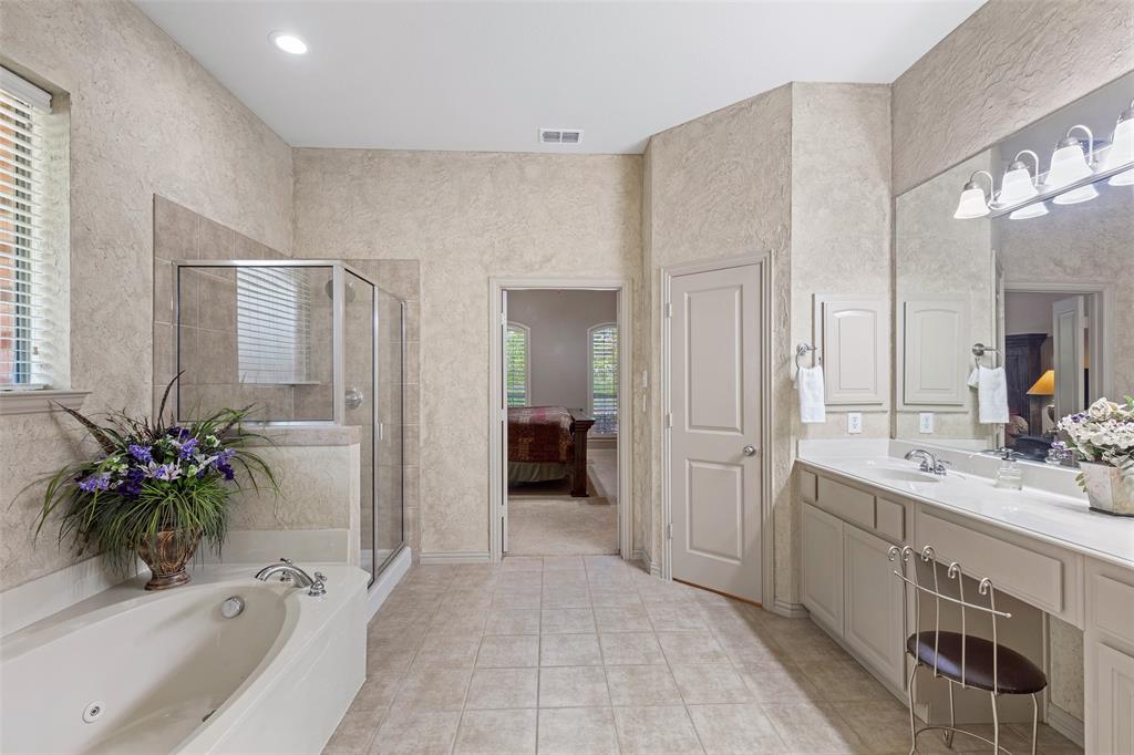 1217 Windmere Way Allen, TX 75013 - Photo 24 of 38 The oversized primary bath delivers a spa-inspired experience with dual vanities, abundant storage, and room to unwind after a long day.