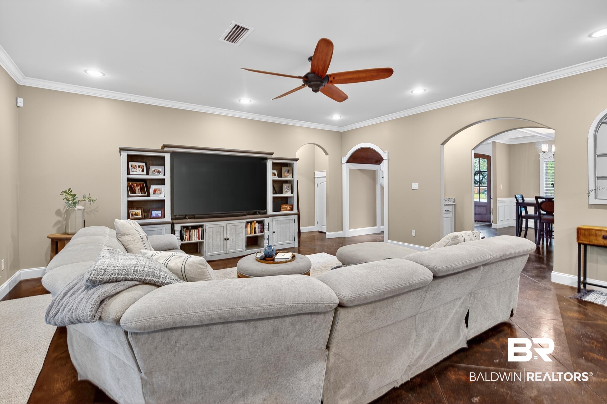 5517 Rabbit Creek Drive Theodore, AL 36582 - Photo 11 of 33 Living room with arched walkways, ornamental molding, recessed lighting, and a ceiling fan