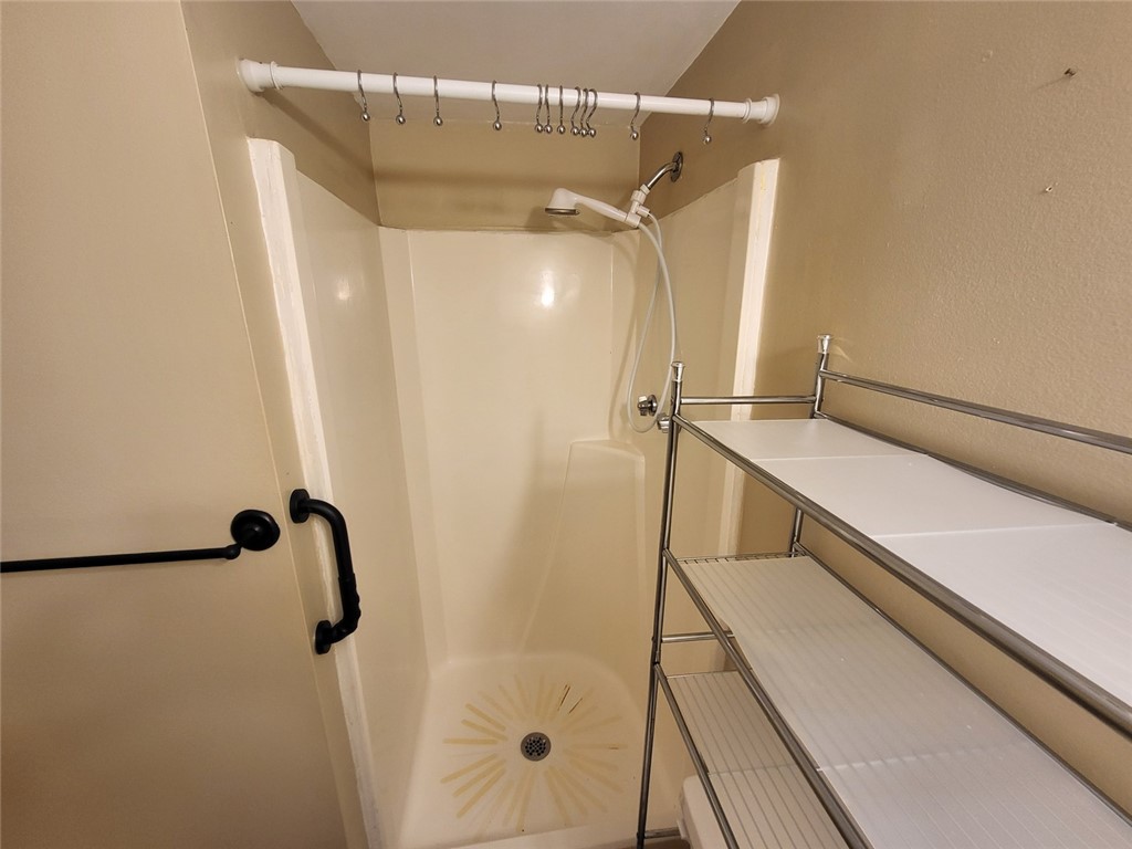 150 Ligon Street, Unit 1001 Clemson, SC 29631 - Photo 22 of 29 A well-maintained shower area offers a convenient and practical bathing solution.