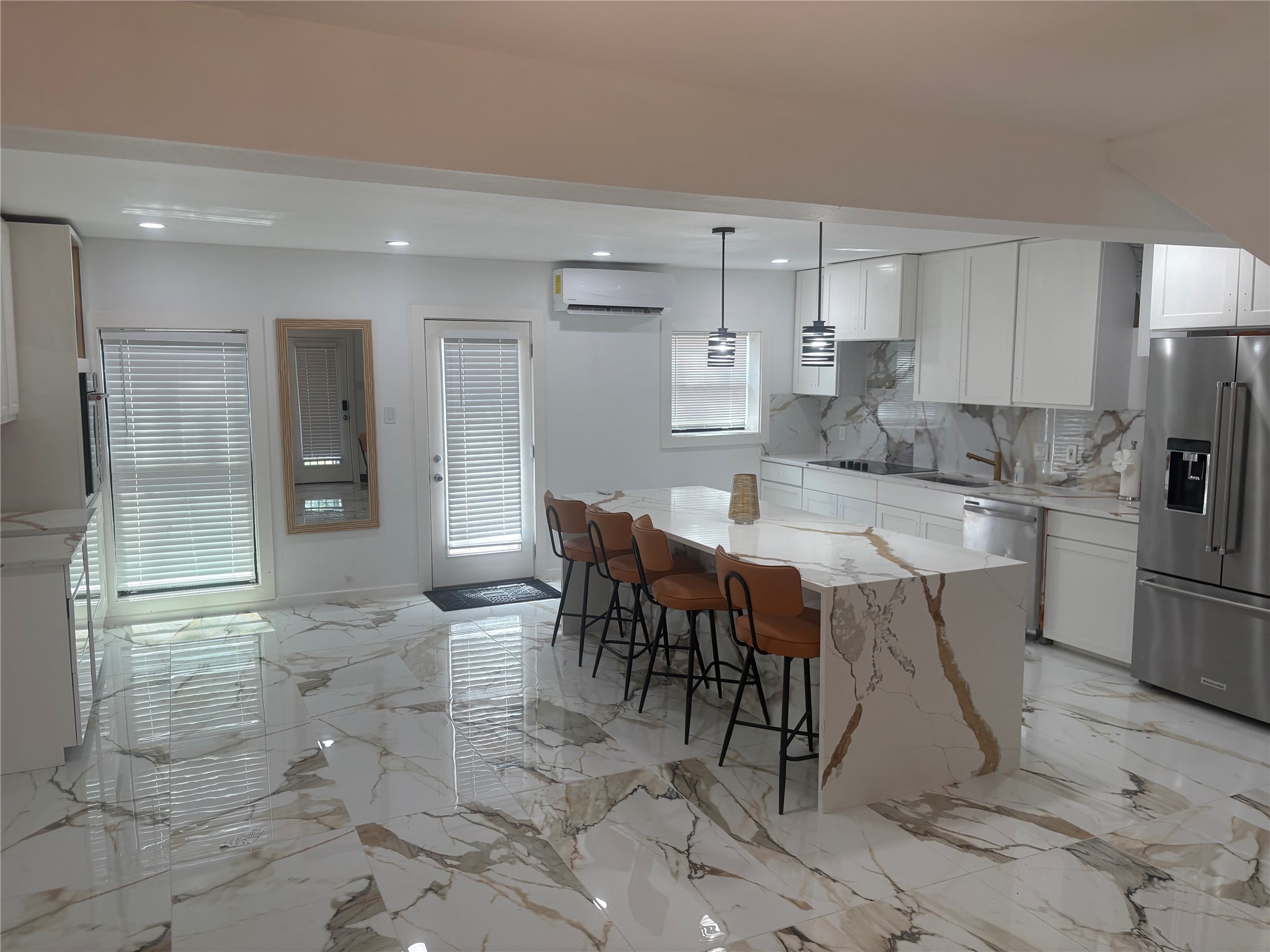 1820 North MacGregor Way Houston, TX 77023 - Photo 16 of 35 a large kitchen with kitchen island a table and chairs