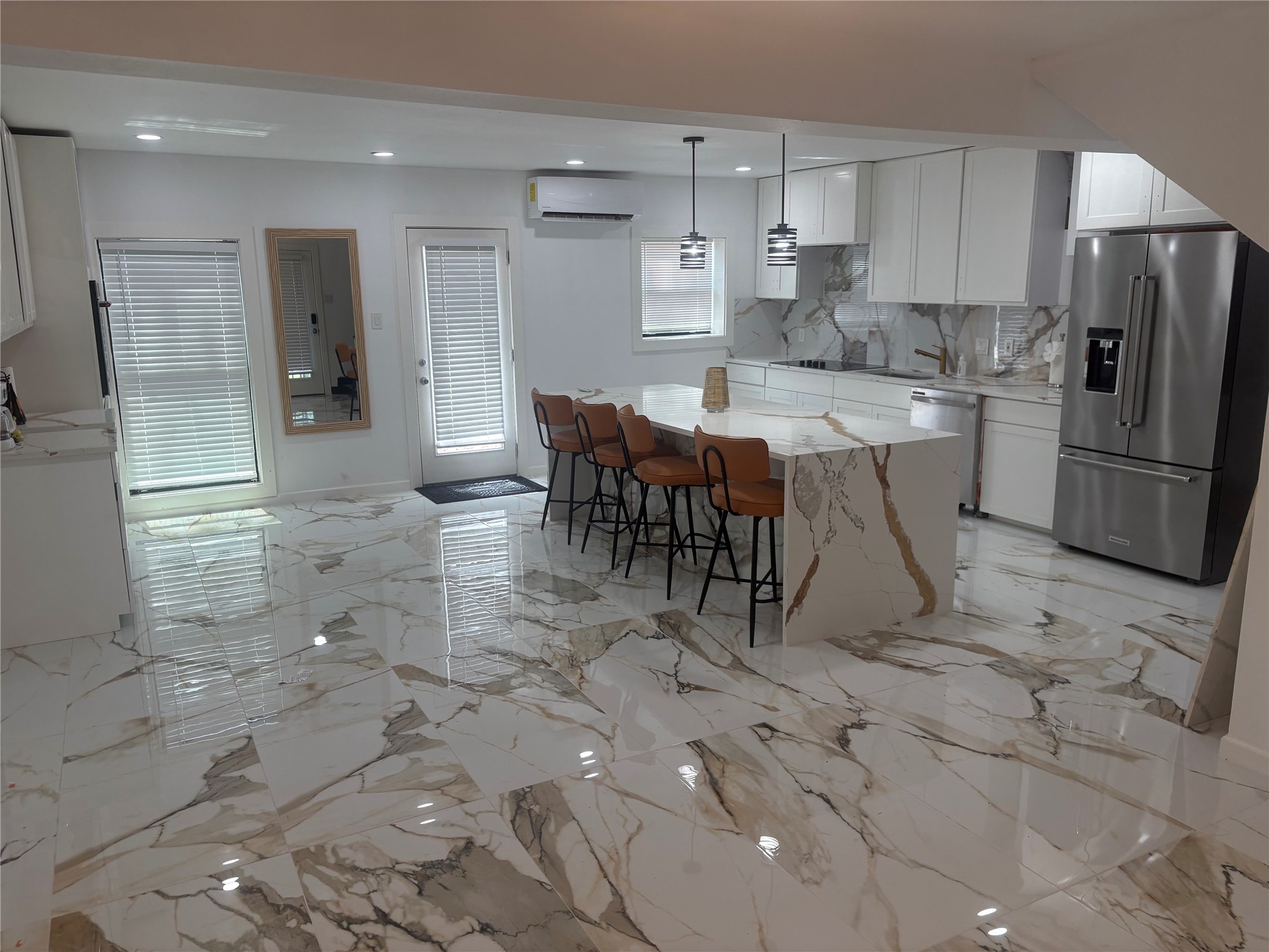 1820 North MacGregor Way Houston, TX 77023 - Photo 17 of 35 a kitchen with stainless steel appliances a refrigerator sink and cabinets