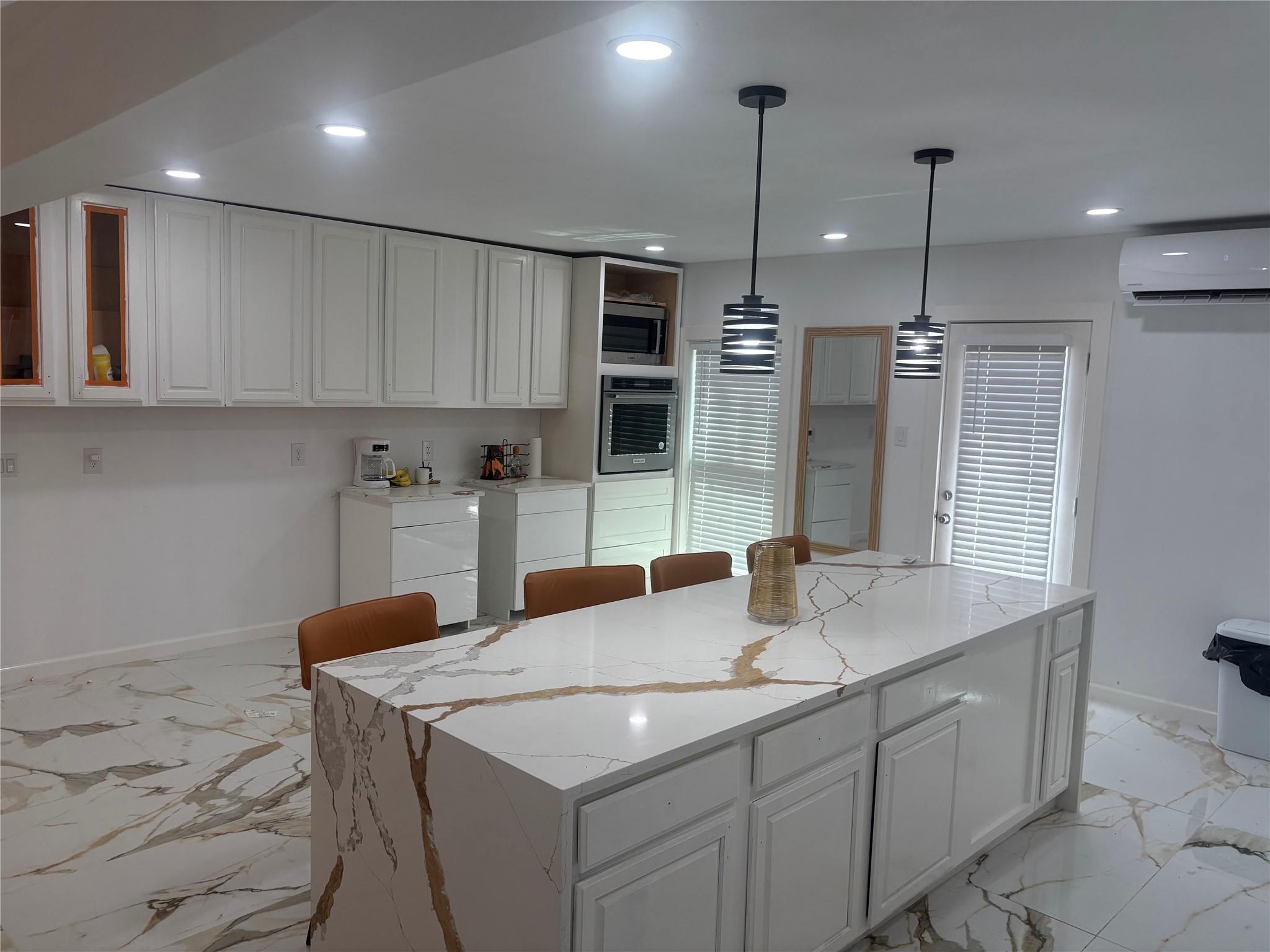 1820 North MacGregor Way Houston, TX 77023 - Photo 20 of 35 a kitchen with stainless steel appliances granite countertop a sink a oven a refrigerator and white cabinets