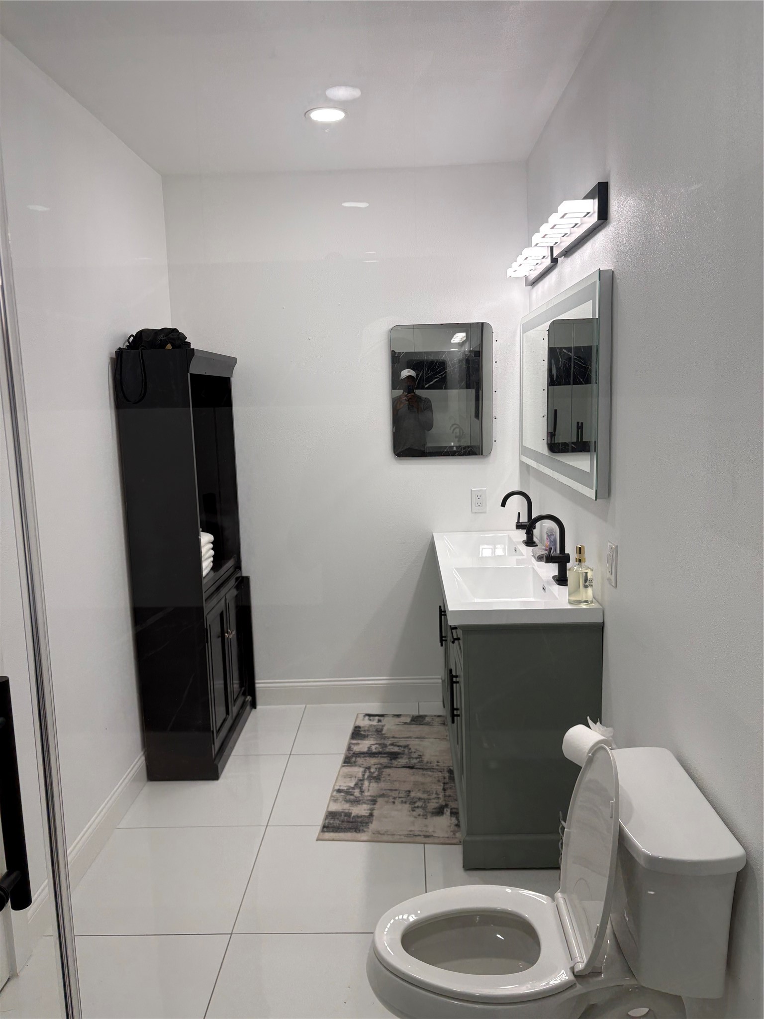 1820 North MacGregor Way Houston, TX 77023 - Photo 23 of 35 a bathroom with a sink toilet and mirror