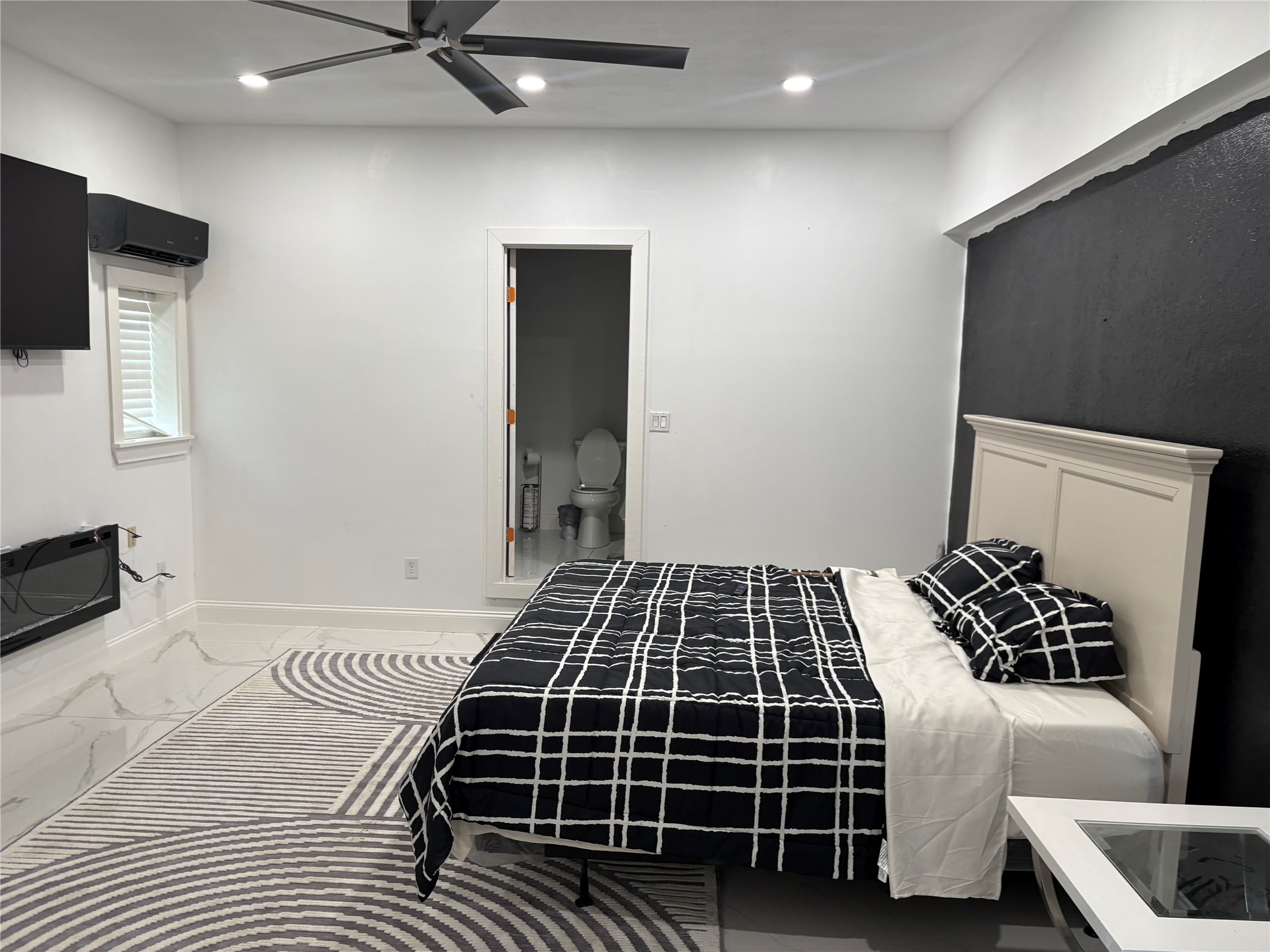 1820 North MacGregor Way Houston, TX 77023 - Photo 25 of 35 a bedroom with a bed and a walk in closet