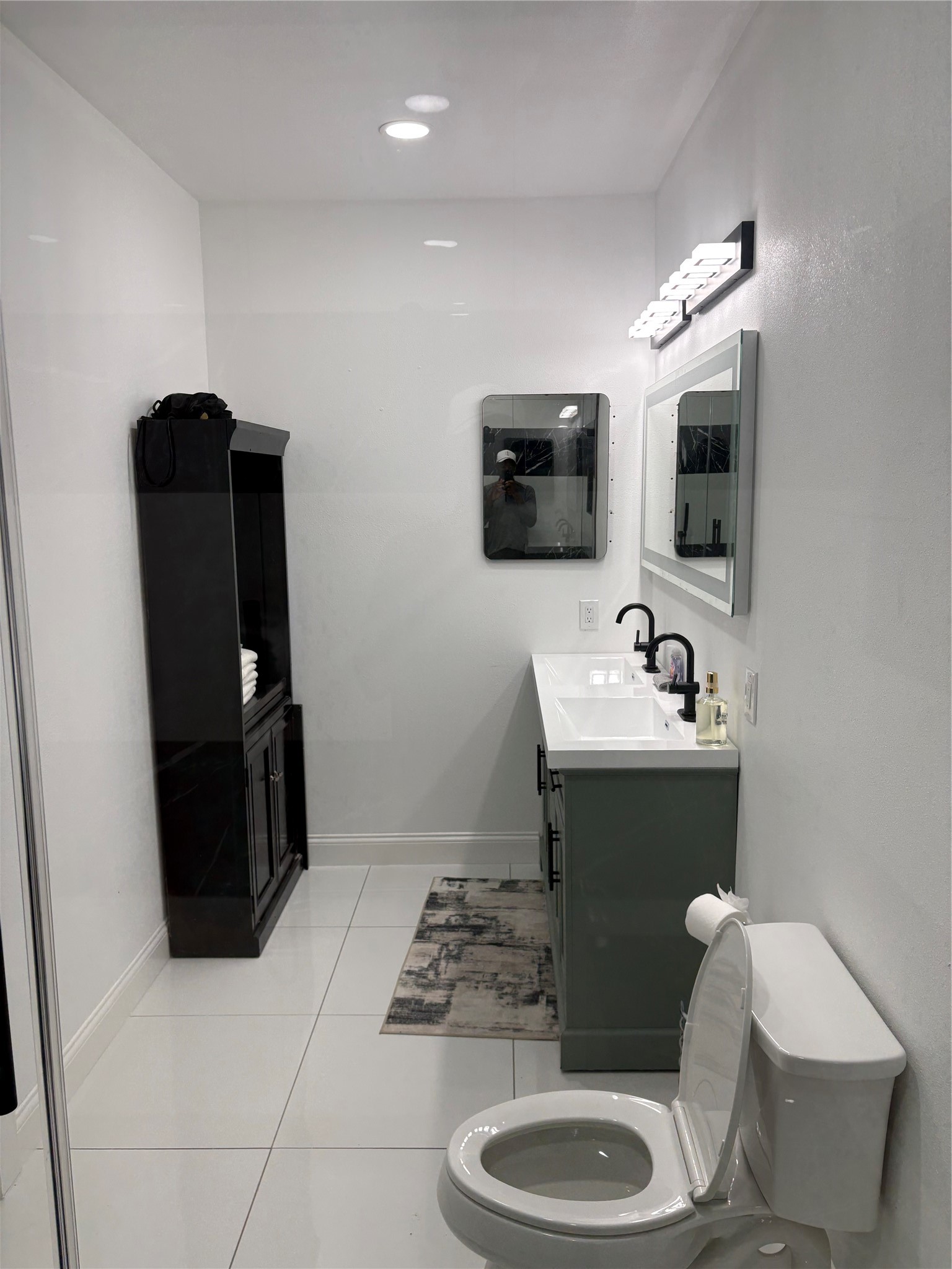 1820 North MacGregor Way Houston, TX 77023 - Photo 27 of 35 a bathroom with a toilet sink and mirror