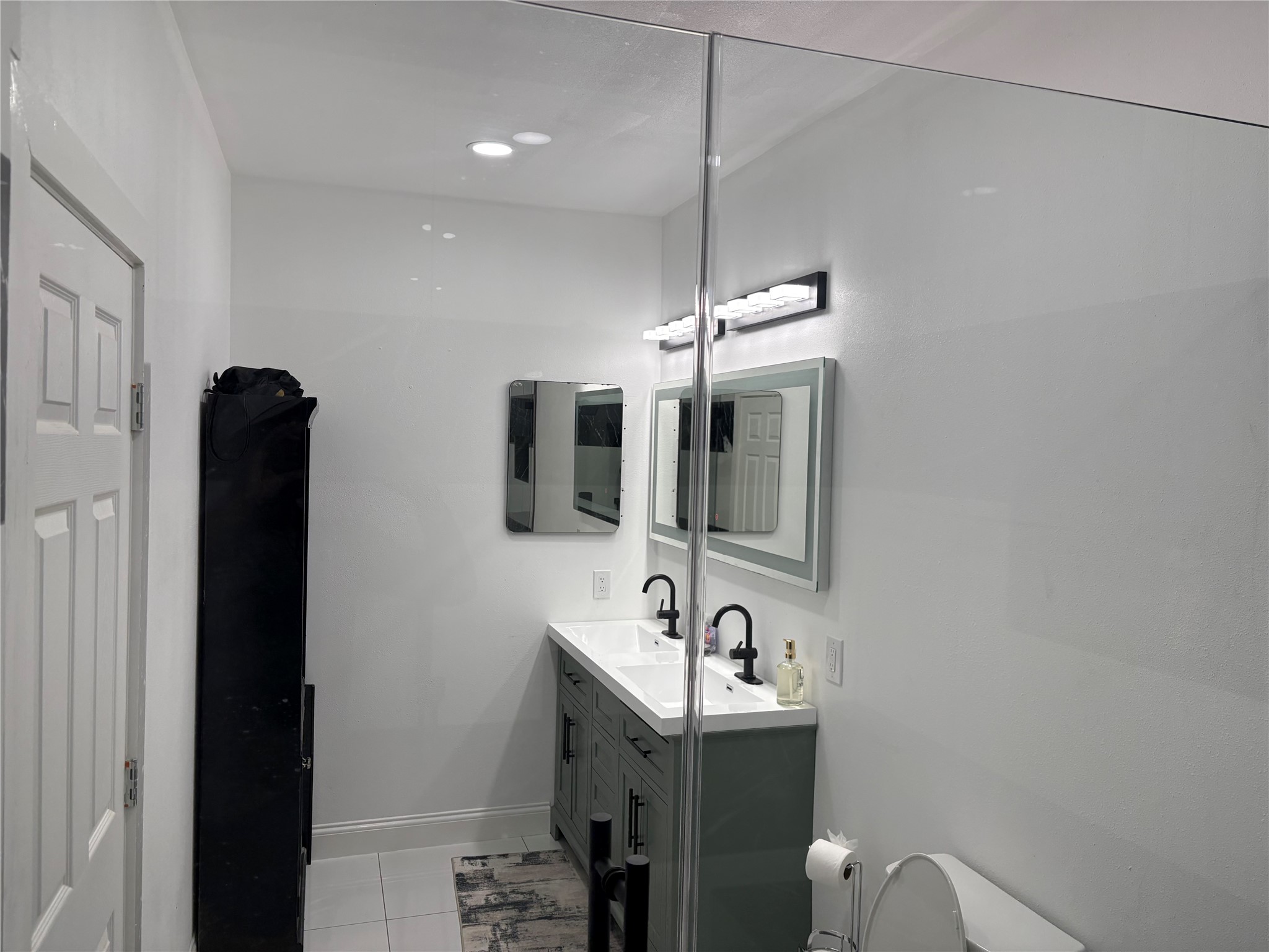 1820 North MacGregor Way Houston, TX 77023 - Photo 28 of 35 a bathroom with a sink and a mirror