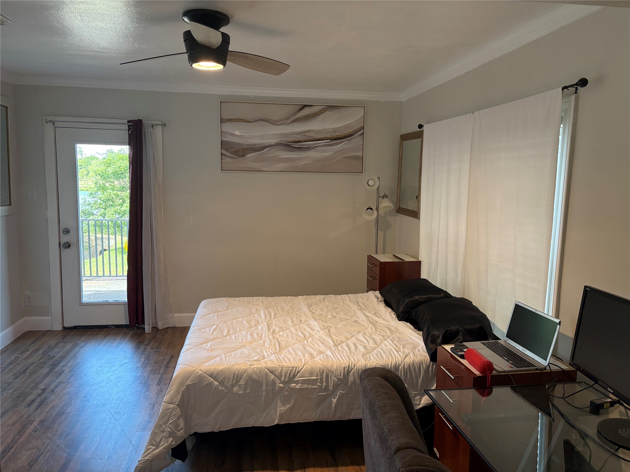 1820 North MacGregor Way Houston, TX 77023 - Photo 29 of 35 a bedroom with a bed and wooden floor