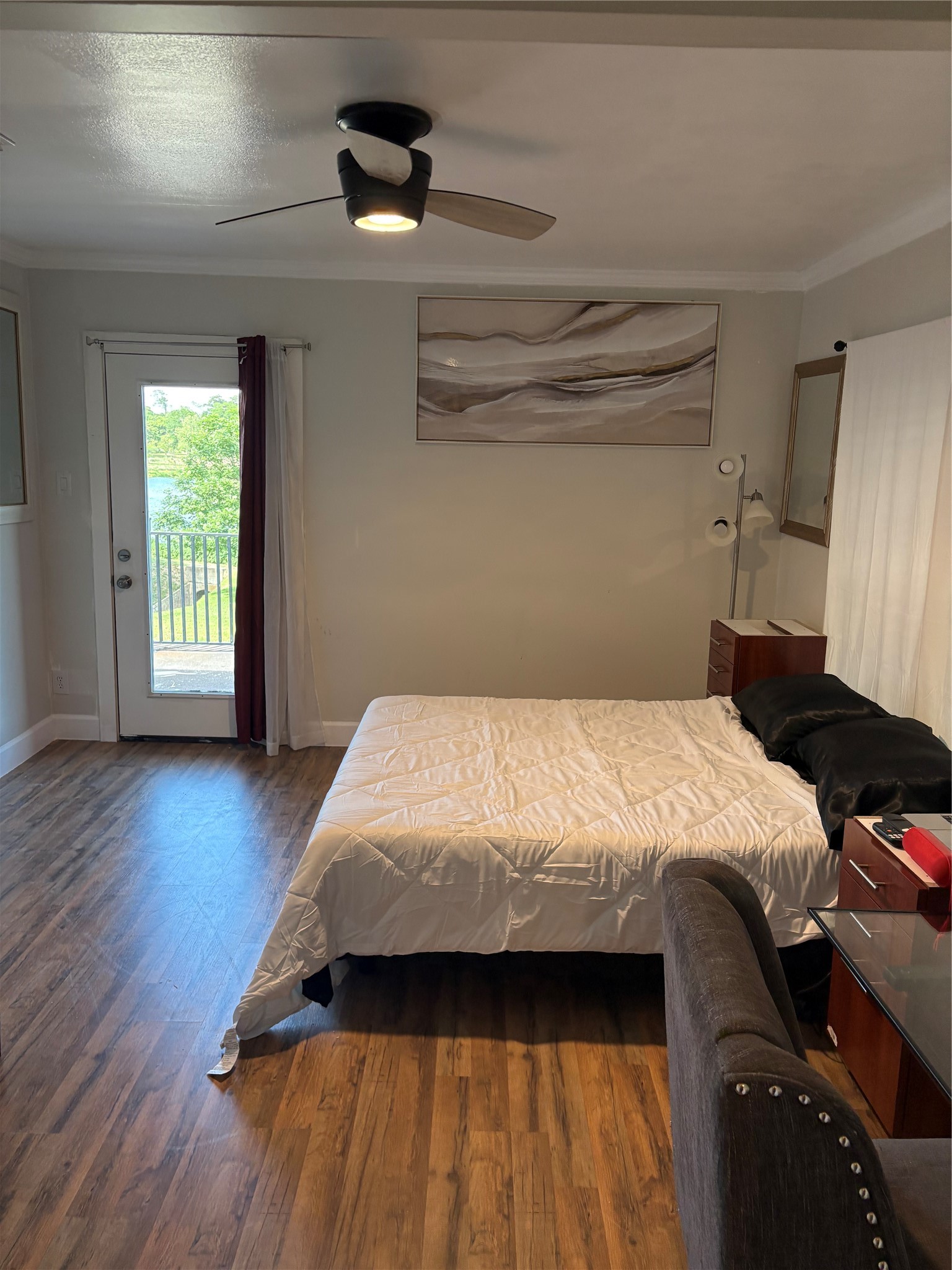 1820 North MacGregor Way Houston, TX 77023 - Photo 30 of 35 a bedroom with a bed and wooden floor