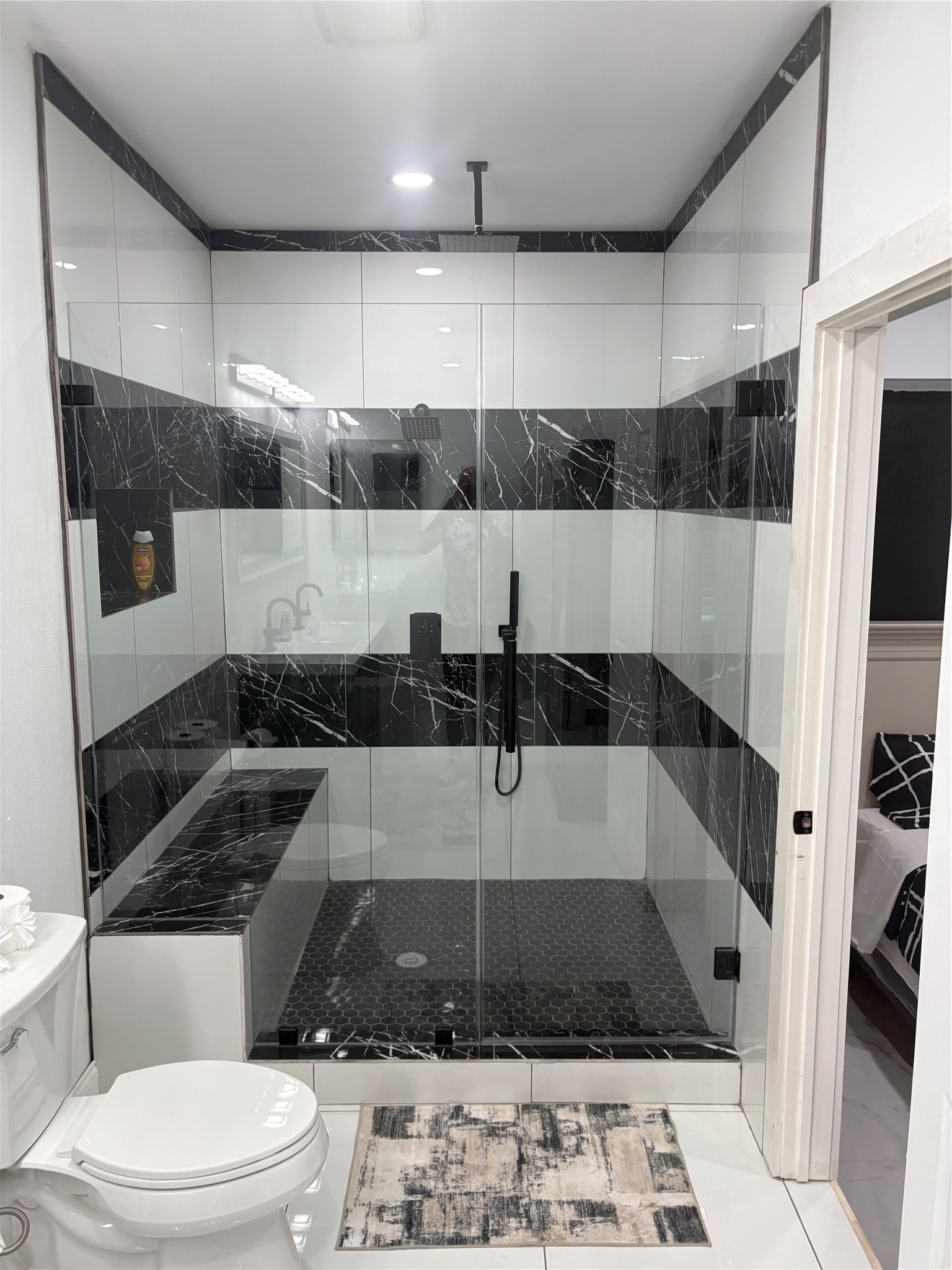 1820 North MacGregor Way Houston, TX 77023 - Photo 5 of 35 a bathroom with a sink a toilet a mirror and bathtub