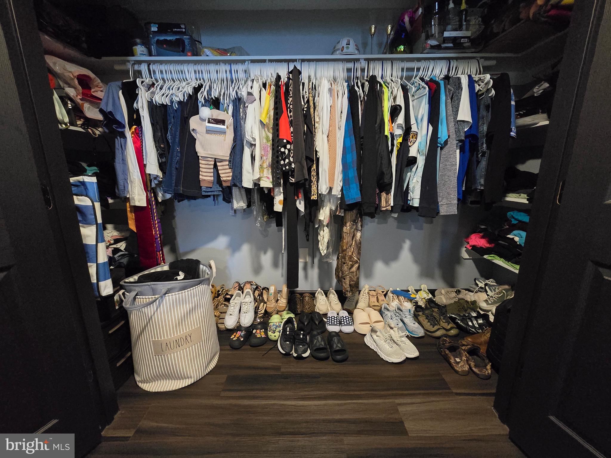7513 Saffron Court Hanover, MD 21076 - Photo 39 of 42 a view of walk in closet with clothes