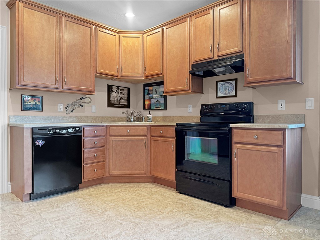4096 Middle Urbana Road Urbana, OH 43078 - Photo 37 of 96 This functional kitchen features ample cabinetry and modern appliances, perfect for everyday living.