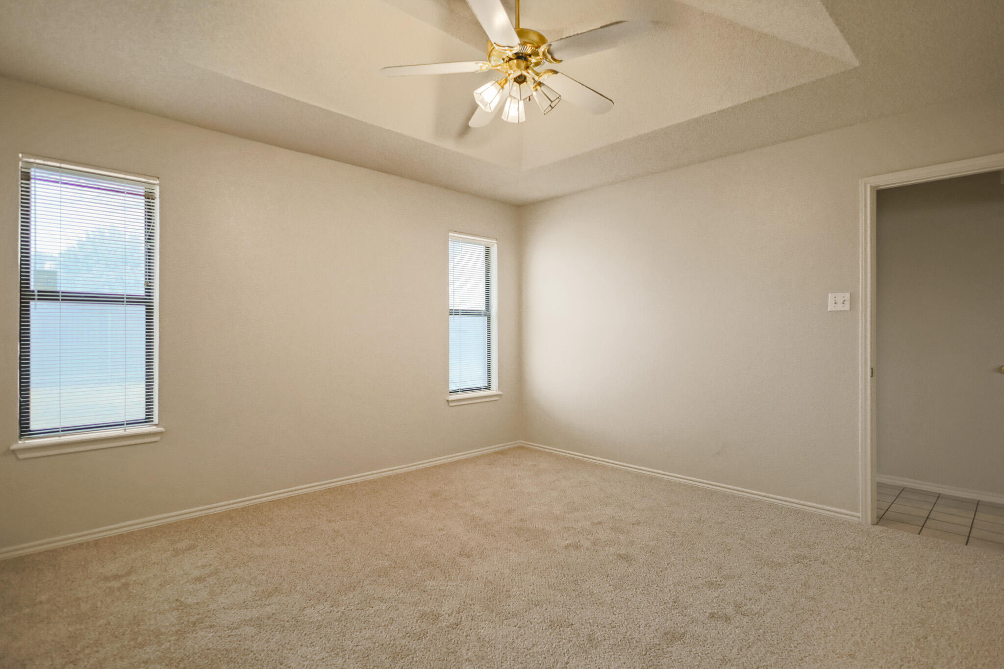 2214 94th Street Lubbock, TX 79423 - Photo 25 of 41 an empty room with windows and fan
